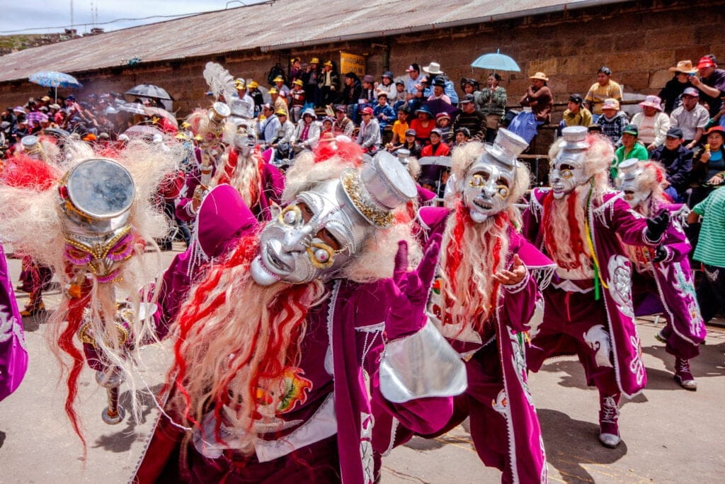 6 Must-Experience Cultural Festivals in South America 11 Dancers with typical devil costumes and other representations celebrate the festival of the Virgen de la Candelaria in Puno, Peru.