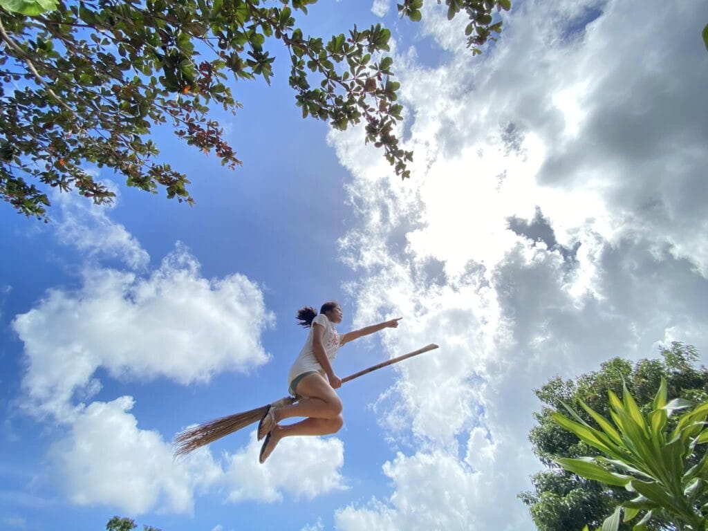 Hapitanan Broomshot - Discover Your Inner Witch 8 This is my favorite broomshot photo from my visit to hapitanan. It shows me flying through the air on a broomstick with wonderful clouds and trees in the background